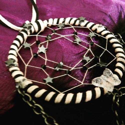 Hematite #stars, chains, and a #butterfly adorn this pink and...