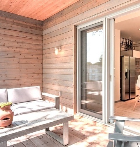 Roof Extensions - Modern DeckMid-sized Minimalist Backyard Deck Photo With A Roof Extension