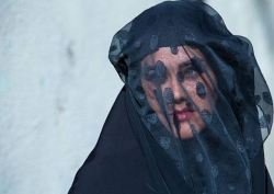 tanyushenka:   Photography: “Iranian Shiite Muslim woman mourning Imam Hussein on the day of Tasua with her face covered by a veil in Khorramabad, Iran”Photographer: Eric Lafforgue   
