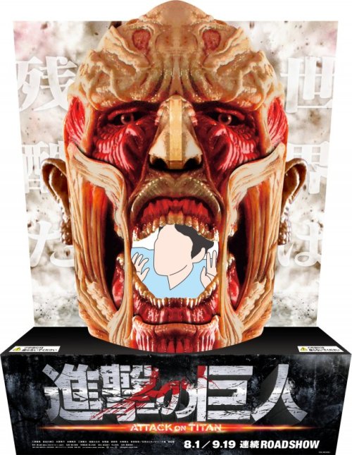 fuku-shuu:  The Colossal Titan cinema display (Announced yesterday as part of the SnK live action films’ promotion) has been captured in person!As the example shows, you can pose behind it and pretend to be eaten!ETA 2015/06/14:Clearly Japanese children