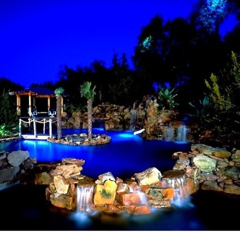 Pool FountainExample Of A Huge Island Style Backyard Stamped Concrete And Custom-shaped Natural Pool