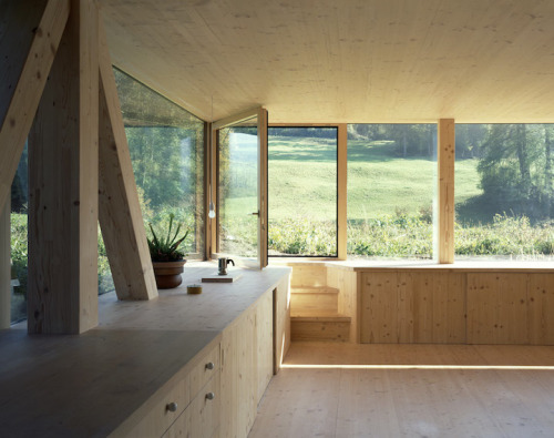 doeyzooey:  Zurich-based architect Pascal Flammer designed this timber house in Balsthal, Switzerland, which is sunken 2.46ft (75cm) with ground-level wrap around windows, connecting it with nature in a special, unique way.  Please….. I want it