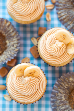 sweetoothgirl:  Banana Cupcakes with Salted Caramel Peanut Butter Frosting  