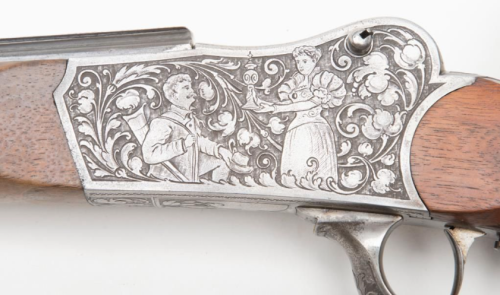 Engraved and carved German schuetzen target rifle crafted by J. Kowar of Amberg, late 19th century.