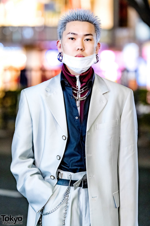 20-year-old Japanese hair stylist Masamune on the street in Harajuku wearing a silver suit from Dog 