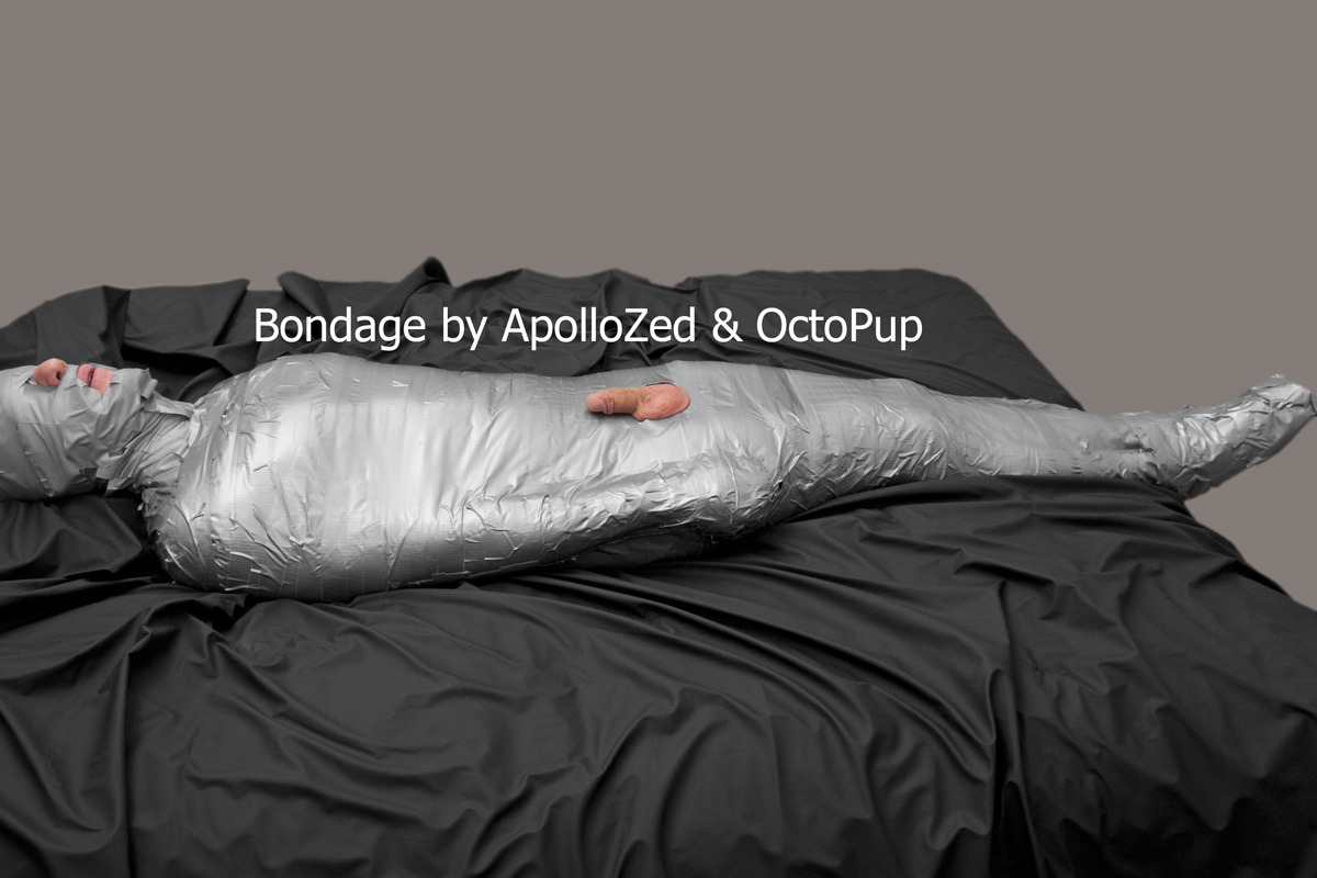apollozed:FetishLA mummified. Duct tape on body and vinyl tape on head. Assistance