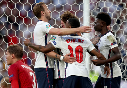 Players of England celebrate an own goal scored by Denmark during the match vs. Denmark