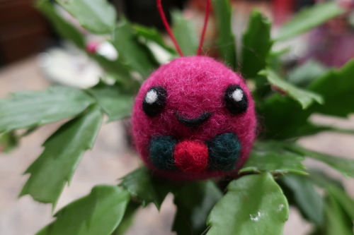 I made a pink slime ornament for my daughter for Christmas. He is a happy little boi with a tiny fes