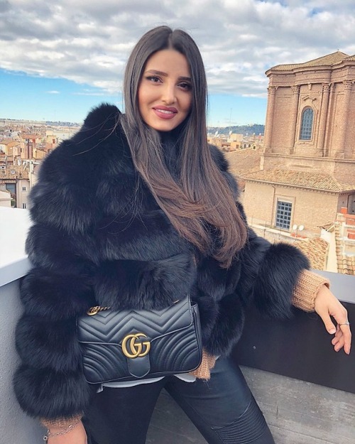 Winter in Rome with faux fur coat, Gucci bag and leather pants.