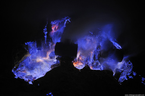 sixpenceee:Neon blue lava pours from Indonesia’s Kawah Ijen Volcano. The reason it’s blue is because