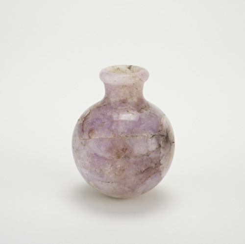 Amethyst BottleThis small container made of beautifully veined amethyst stone would have been a luxu