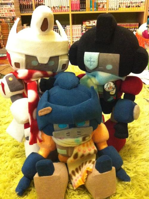 sowiddlefur:  Oh, I never posted the plushie Ironfist I made myself here. I have a plushie family of 3. :D Ironfist has a hole in his helm and Drift made him a special band-aid to cover the hole… Yes, I was super sad he died in the comics and I adore