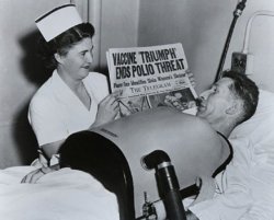 sixpenceee:Nurse showing newspaper headline