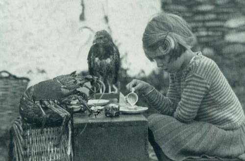 vladscastle:A young girl having a tea party with a lobster and a hawk, 1938.