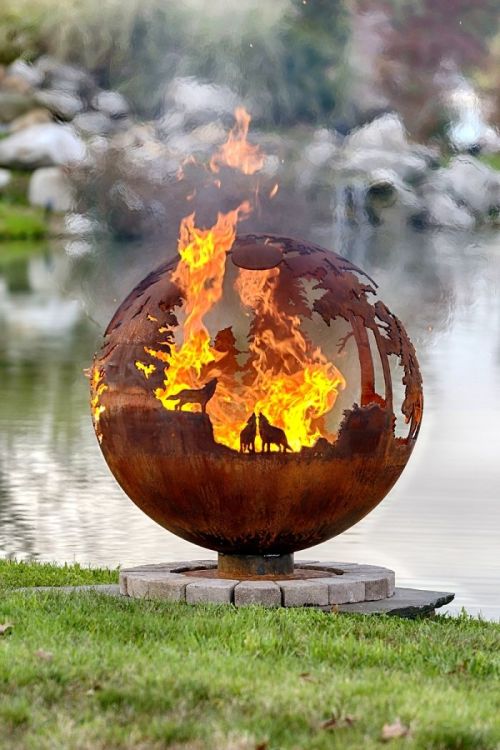 asylum-art:  iBeautiful Metal Firepits Of Art by The Firepit Company  The Wilderness Ball This Firepit features a wilderness scene. Including Stag, Doe and Fawn, Wolf, Moose, Swan and a flock of Geese flying accross the skyline.