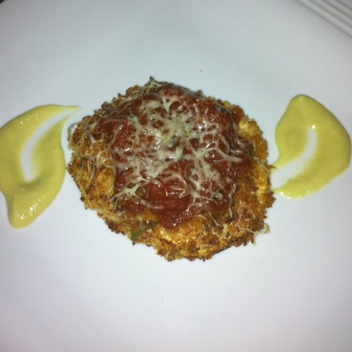 Sicilian eggplant parmigiana, served with 24 hr homemade marinara reduction and lemon avocado cream 