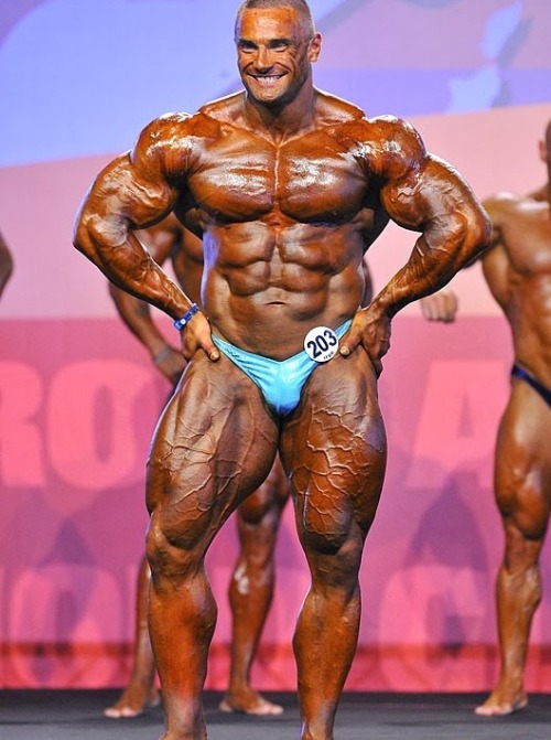 sannong:    Tomas Kaspar - Part 1: Stage Shots. Holy fuck! The bulging road map veins covering every inch of his beautifully mutated legs, the monstrous, deeply striated and ripped traps, the shredded sucked in bodybuilder face that just scream raw power.