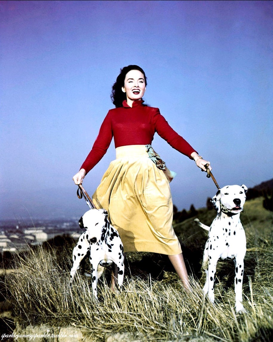 Ann Blyth walks her dalmatians in the Hollywood Hills, 1952.