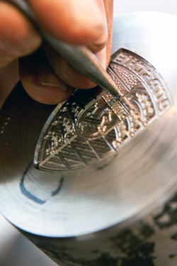 zxxxxvxvsvv:  Porsche crest being hand-etched.