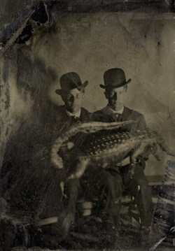 Portrait of Two Men with an Alligator Across