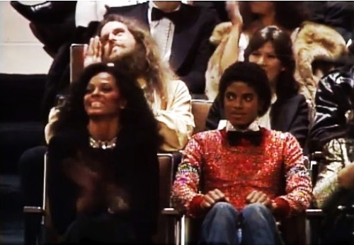 linrenzo:  zrunkinlove:  michaeljacksonsdick:  thexscape:  michaelmakesmewet:  michaeljacksonsdick:  myinspirationmj:  AMA, 1981  IS THAT JESUS BEHIND DIANA?!  He looking like he saying ” father mike is slayin me with this red sparkly ass sweater “