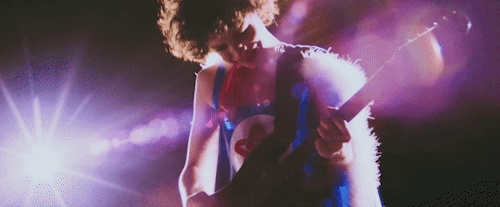 Young Danny strums an electric guitar solo while wearing his present version's Ninja Sex Party costume.