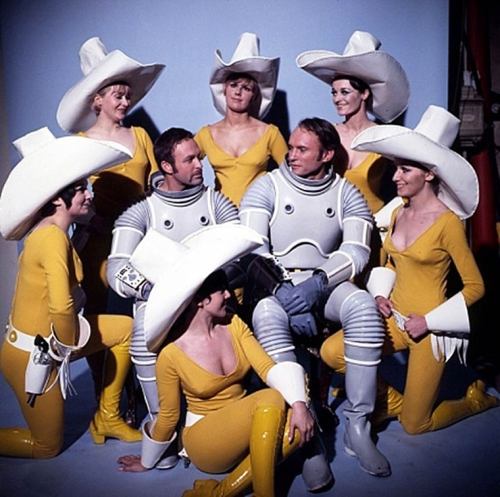 atomic-flash:  Russian-born Korminski (Ori Levy) and his captain, former U.S. astronaut pioneer, William H. Kemp (James Olson) - two for-hire space scavengers - are surrounding by moon-based showgirls in a publicity still from the 1969 sci-fi action cult