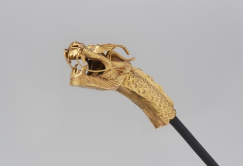 There is a tremendous sense of movement in this diminutive dragon decoration—once used as a fi