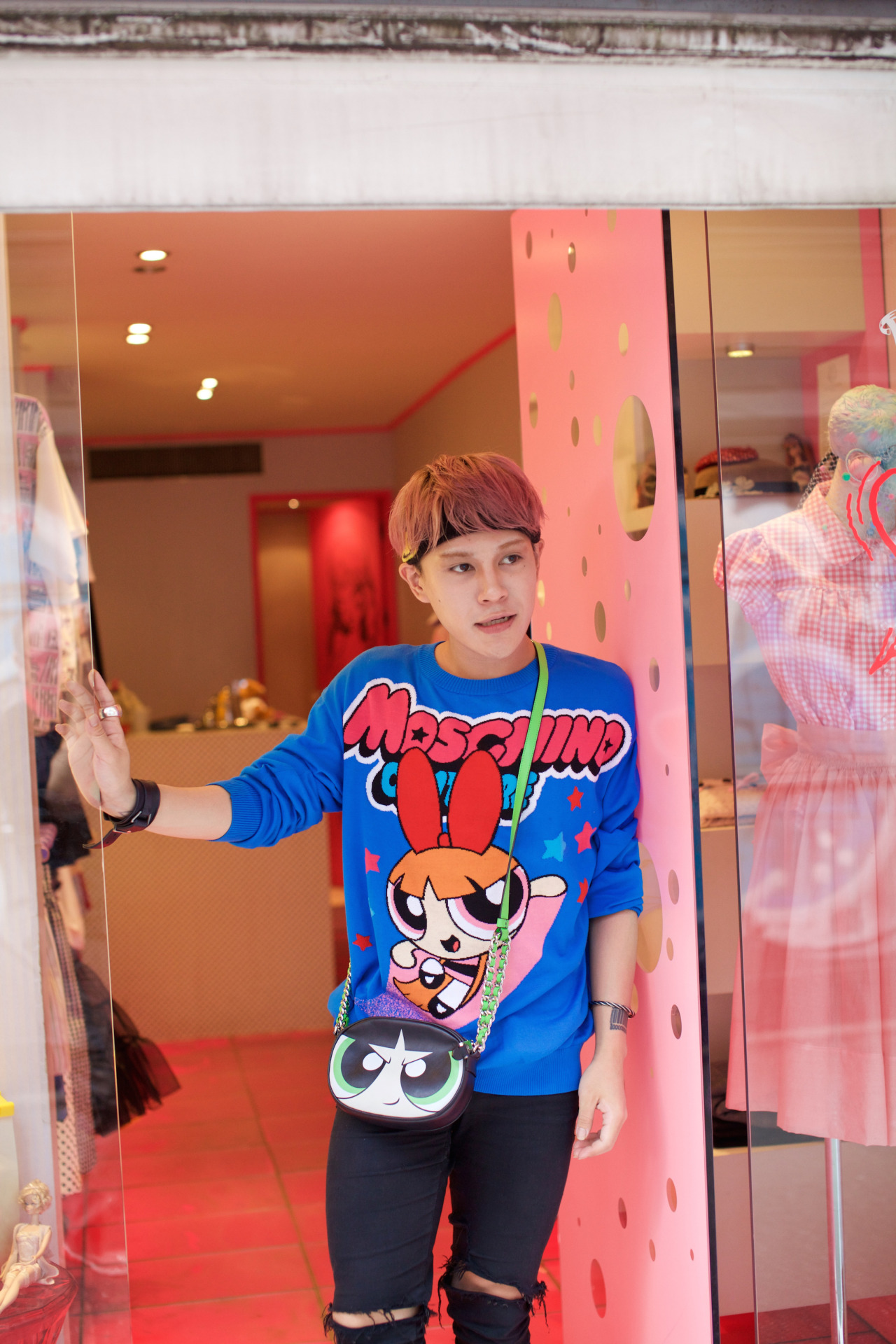 <p>Store clerk in blue and pink in Harajuku, Tokyo.</p>