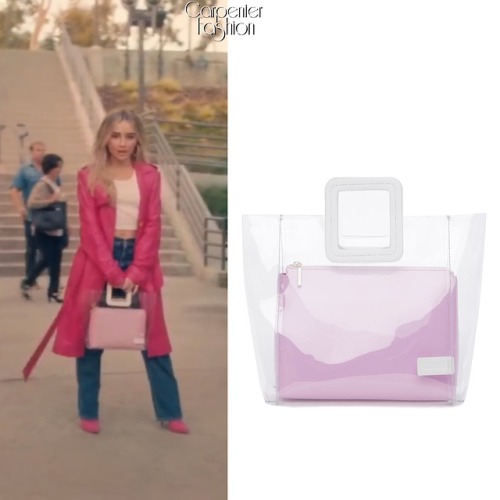 Sue Me Music Video. Sabrina Carpenter carried the Staud ‘Shirley Bag - Clear Pink/Patent White’ ($21