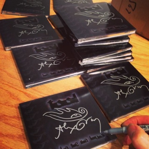 Alex Grey signing TOOL lateralus cd’s adult photos