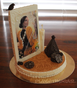 playwithdinos:  Chocolate amenity - Dragon Age ThemedEdible printer paper, lindt couverture, modelling chocolate, gold dustEdit: I meant to post this on my pastry//baking sideblog (thus the watermark) but I forgot to change blogs before posting so here