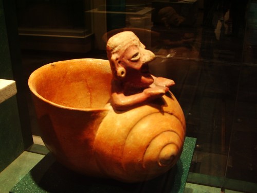 Anthropomorphic figurine showing an elderly person emerging from a conch shell, Ancient Maya. C