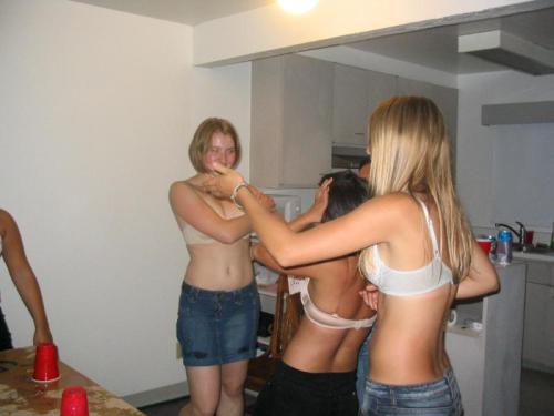 A wonderful embarrassed strip beer pong game, with a large group of cute girls getting down to their