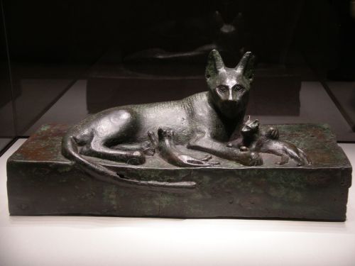 Ancient Egyptian bronze sculpture of a cat and her kittens, thought to have been created in honor of