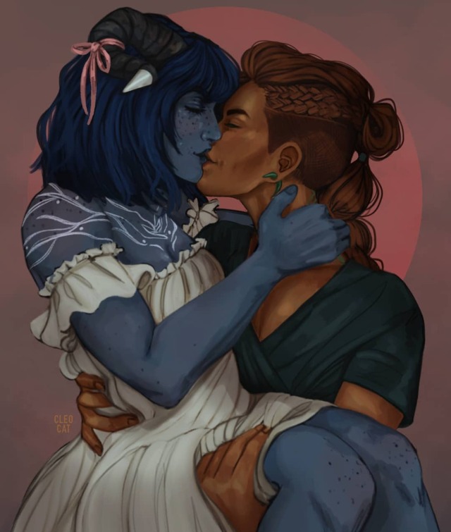 The same composition and background as the first photo, but in this one Jester and Beau are kissing softly.