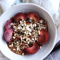 themilkywhiteway:  Happy Friday🎉cacao oatmeal with plums, puffed brown rice, quinoa, cacao nibs, dried pom seeds, barberries, dried blueberries, goji berries, sesame/pumpkin/sunflower/chia seeds and toasted coconut flakes