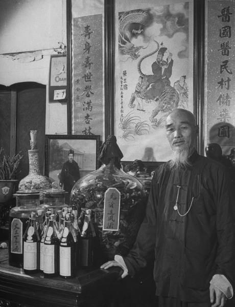 George Silk: Tiger Bones series, Shanghai, 1946 1. Dr. Chen Chu, a tiger bone doctor, standing in hi