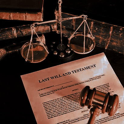 a law student's table set up with papers, books, a pair of scales and a judge's gavel. 