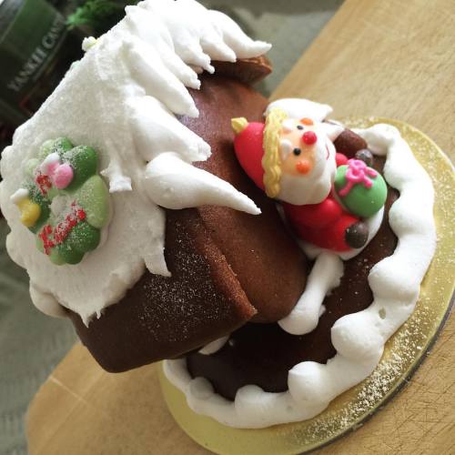 Quality time on Christmas Day with mom means both of us demolishing a small gingerbread house. Yum! 