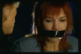 sittightbondage:  A very cute red haired Dutch damsel is captured by a leather clad