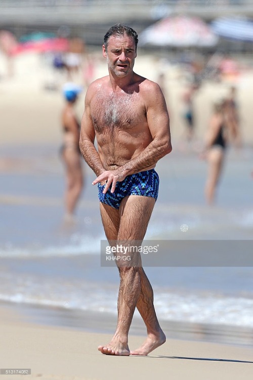 bizarrecelebnudes:  Andrew O’Keefe - Aussie Tv Presenter (Part 1) Love him. He always loves showing of in speedos by the beach. Love his hairy body. 