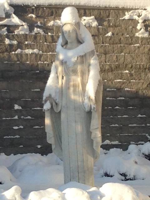 family-of-god:Look how the snow fell! It looks like Our Blessed Mother is carrying a person. Wh