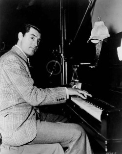 archiesleach: Cary Grant plays piano on the set of The Philadelphia Story, 1940.