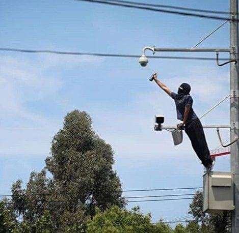 Painting cameras in Maipu, Chile