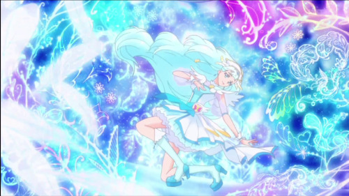 [Image description: Cure Ange from Hugtto Precure striking her transformation pose as glowing feathe