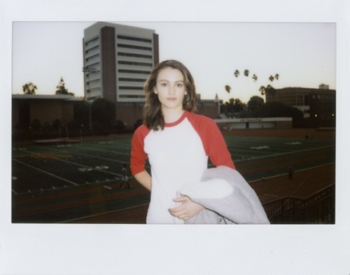 americanapparel:  Elena wearing the Unisex Wool Club Jacket With Leather Sleeves, Unisex Poly-Cotton ¾ Sleeve Raglan Shirt, NEW Stretch Denim Pencil Pant and Unisex Tennis Shoe 