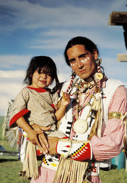 Steven Garcia with his daughter Cheyenne during the Oglala College powwow on the Pine Ridge Reservat