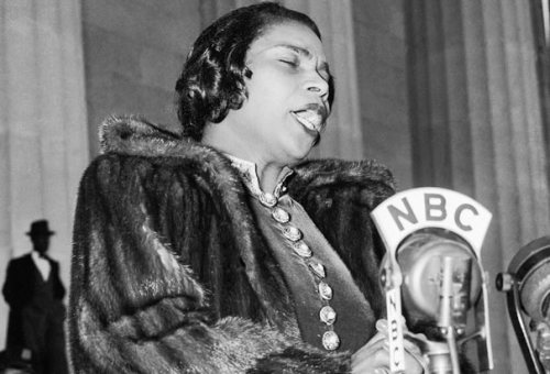 Popular quotes by Marian Anderson. As long as you keep a person down, some part of you has to be dow