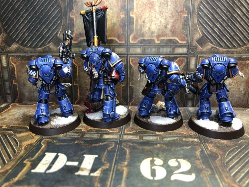 a-40k-author:cam2d:Ultramarines Intercessors, sans a guy who got melted by plastic glue.They’re perf